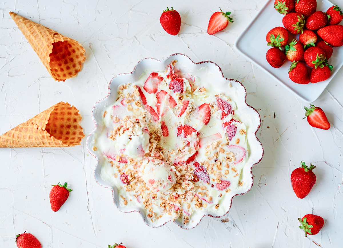 no-churn ice cream with strawberries and empty ice cream cones