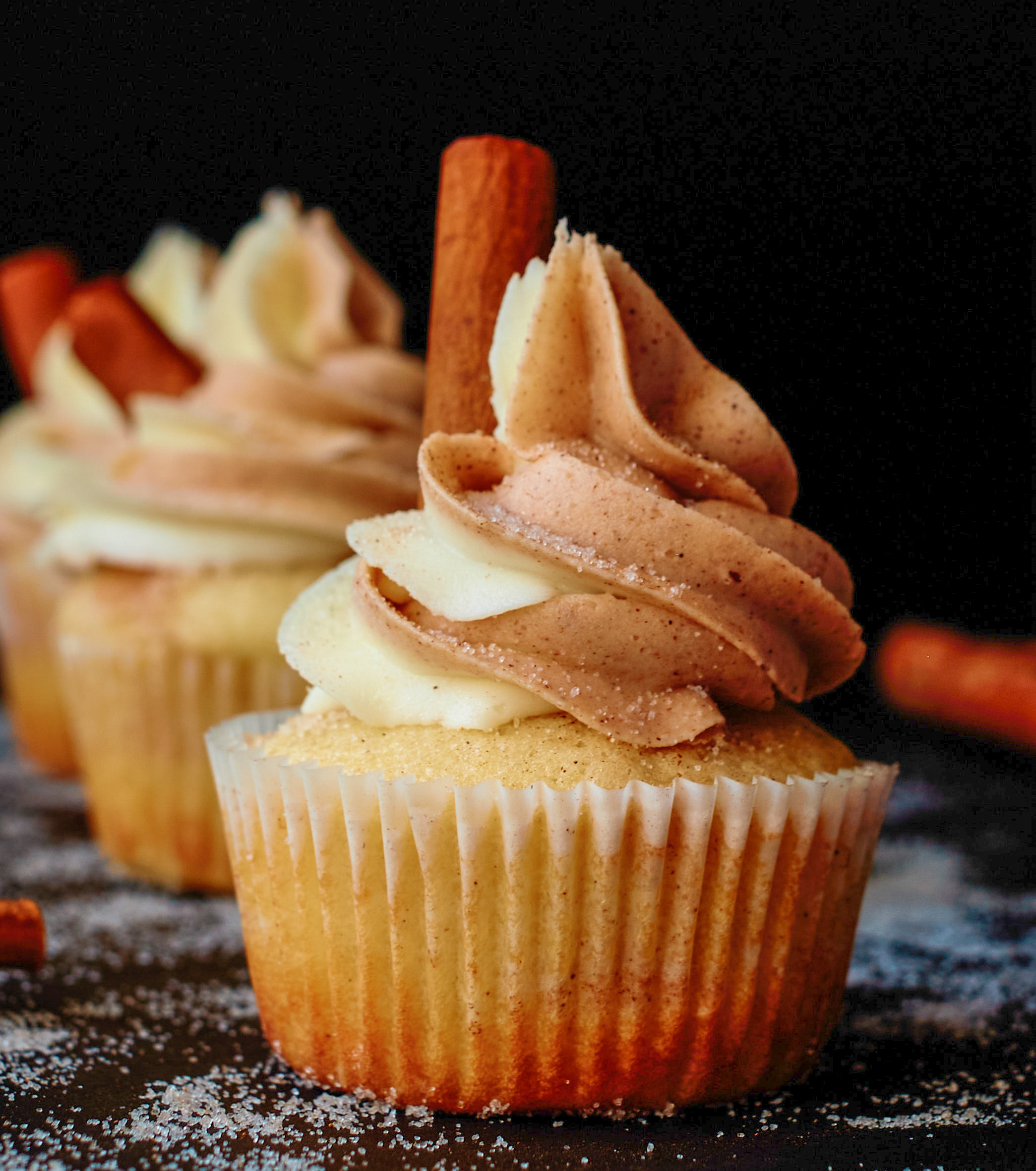 frosted cupcake with cinnamon stick
