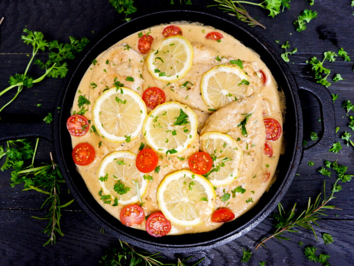 Cast Iron Skillet Creamy Lemon Chicken is the perfect weeknight meal! A simple cream sauce, garlic, fresh rosemary and other herbs for a delicious flavour.