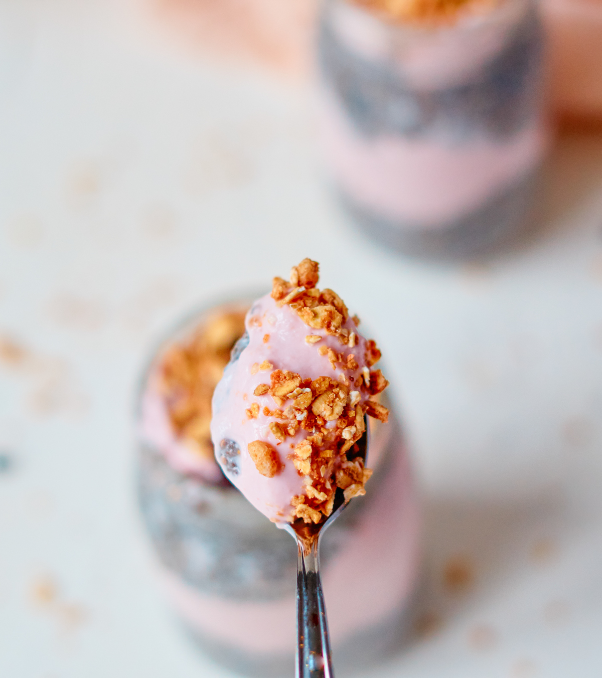cherry chia seed pudding on a spoon