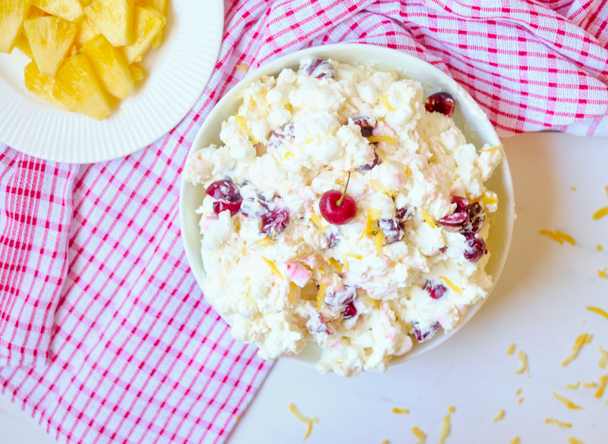 cherry pineapple fluff with coconut in a big bowl