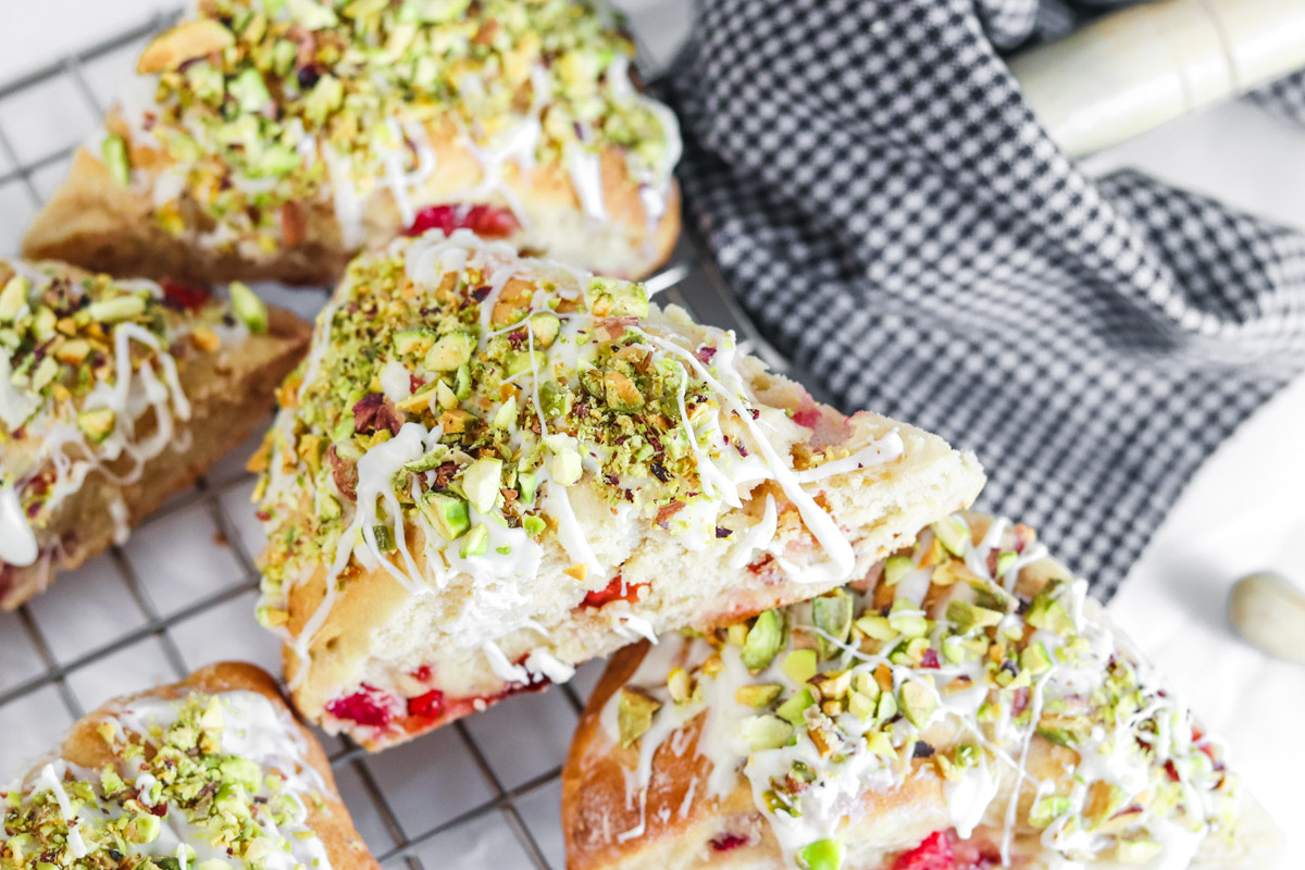 Finished scones with pistachios, cherries and white chocolate drizzle