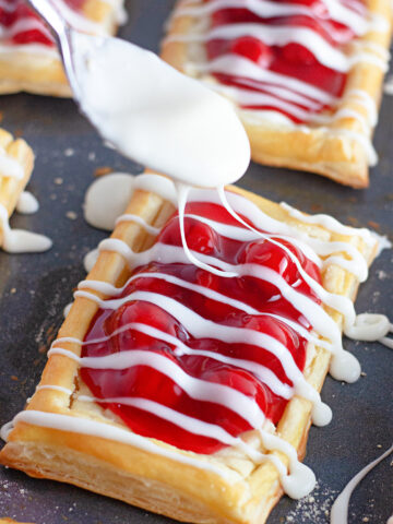 adding icing onto danishes