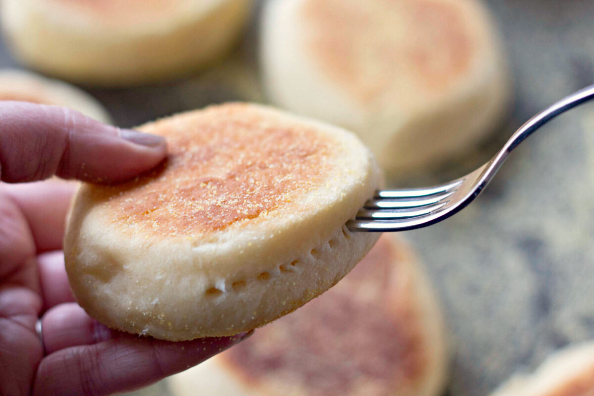 using a fork to split english muffins in half
